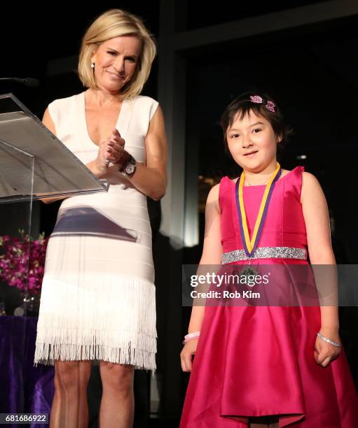 Mistress of Ceremonies Dr. Jennifer Ashton and junior ambassador Audrey DeShetler speak onstage at the Solving Kids' Cancer Spring Celebration: 10...