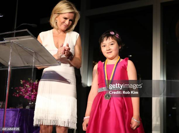 Mistress of Ceremonies Dr. Jennifer Ashton and junior ambassador Audrey DeShetler speak onstage at the Solving Kids' Cancer Spring Celebration: 10...