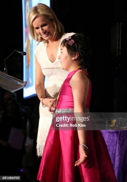 Mistress of Ceremonies Dr. Jennifer Ashton and junior ambassador Audrey DeShetler speak onstage at the Solving Kids' Cancer Spring Celebration: 10...