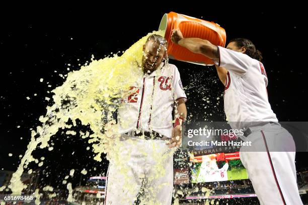 Matt Wieters of the Washington Nationals has gatorade dumped on him by teammate Anthony Rendon after hitting a single two run RBI walk-off during the...