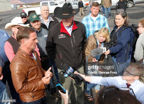 Rep. Chris Stewart , and U.S. Secretary of the Interior Ryan Zinke, , talk to reporters before departing Kanab Airport on May 10, 2017 in Kanab,...