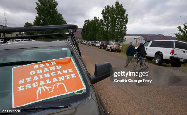 Protesters walk to the Kanab Airport to protest U.S. Secretary of the Interior Ryan Zinke on May 10, 2017 in Kanab, Utah. Zinke has been in the state...