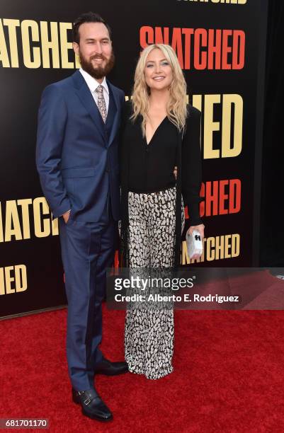 Musician Danny Fujikawa and actor Kate Hudson attend the premiere of 20th Century Fox's "Snatched" at Regency Village Theatre on May 10, 2017 in...