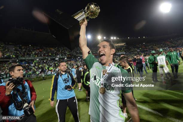 Diego Arias of Nacional lifts the trophy to celebrate after winning a match between Atletico Nacional and Chapecoense as part of CONMEBOL Recopa...