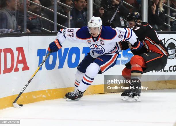 Connor McDavid of the Edmonton Oilers skates against Hampus Lindholm of the Anaheim Ducks in Game Seven of the Western Conference Second Round during...