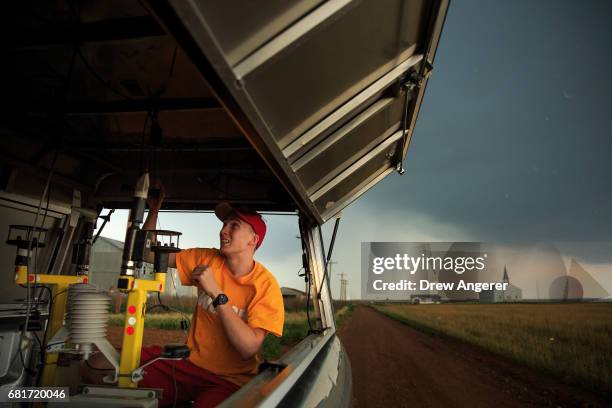 Center for Severe Weather Research intern Hunter Anderson prepares tornado pods as a severe thunderstorm moves into the area in Paducah, Texas, May...