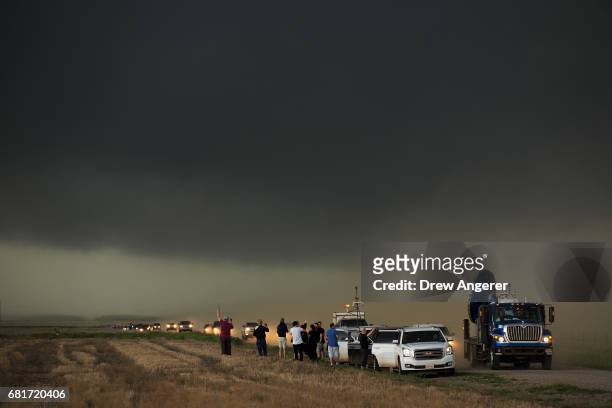 Caravan of storm chasers arrive on the scene of a supercell thunderstorm, May 10, 2017 in Olustee, Oklahoma. Wednesday was the group's third day in...