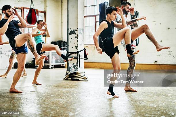 muay thai boxing athletes training in a gym - muaythai boxing stock pictures, royalty-free photos & images