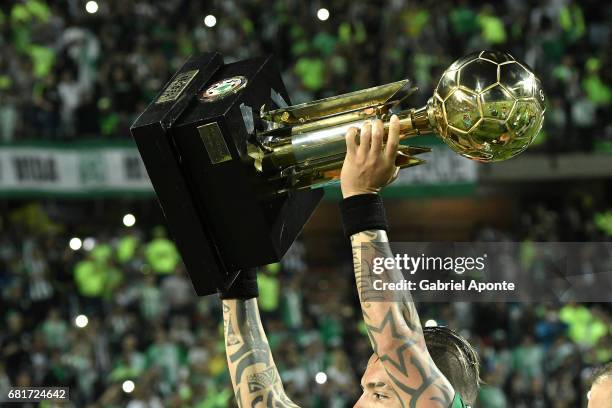 Dayro Moreno lifts the trophy to celebrate after winnig a match between Atletico Nacional and Chapecoense as part of CONMEBOL Recopa Sudamericana...