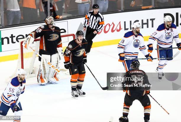 Josh Manson of the Anaheim Ducks reacts with Jakob Silfverberg and goaltender John Gibson after their 2-1 win over the Edmonton Oilers in Game Seven...