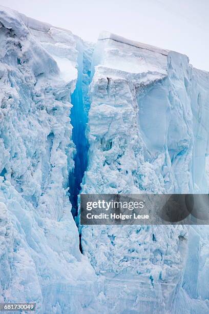 blue glacier crevasse - crevasse fotografías e imágenes de stock