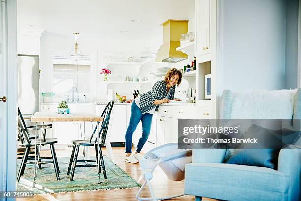 laughing woman in home kitchen - cozy kitchen stockfoto's en -beelden