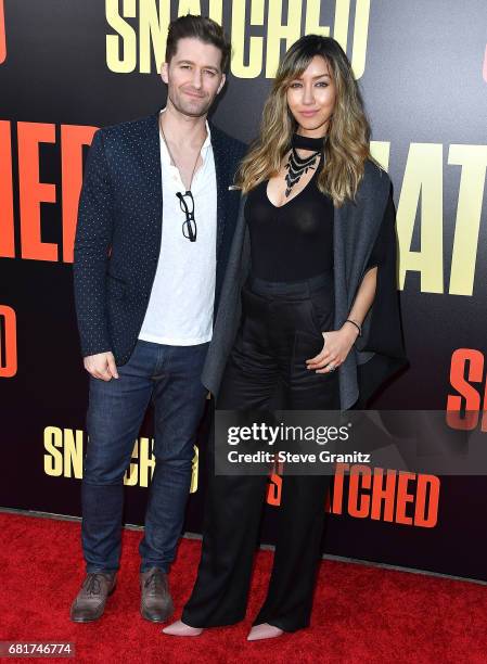 Matthew Morrison, Renee Puente arrives at the Premiere Of 20th Century Fox's "Snatched" at Regency Village Theatre on May 10, 2017 in Westwood,...