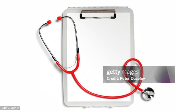 clipboard with a red stethoscope and copy space - red stethoscope stock pictures, royalty-free photos & images