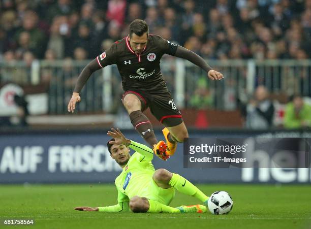 Soeren Gonther of FC St. Pauli and Tim Kleindienst of 1. FC Heidenheim battle for the ball during the Second Bundesliga match between FC St. Pauli...
