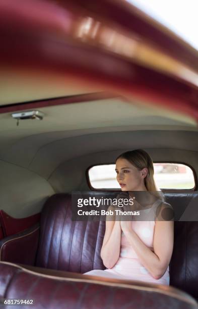 Young Woman In A Classic Car