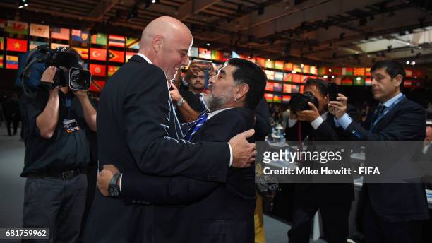 President Gianni Infantino greets FIFA Legend Diego Maradona ahead of the 67th FIFA Congress at the Bahrain International Exhibition & Convention...