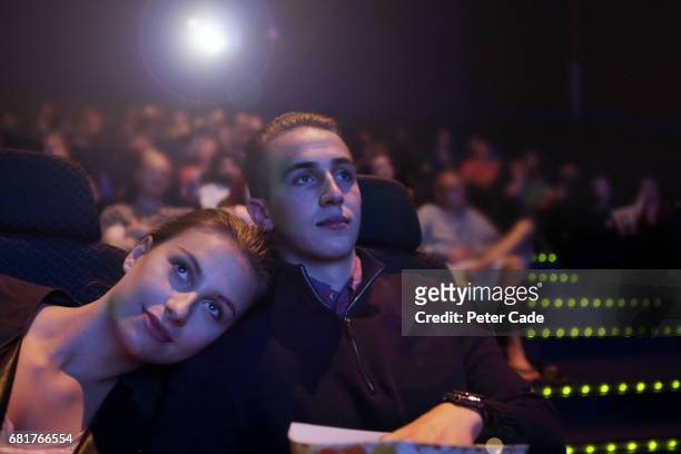 young couple in cinema - loving 2016 film stock pictures, royalty-free photos & images