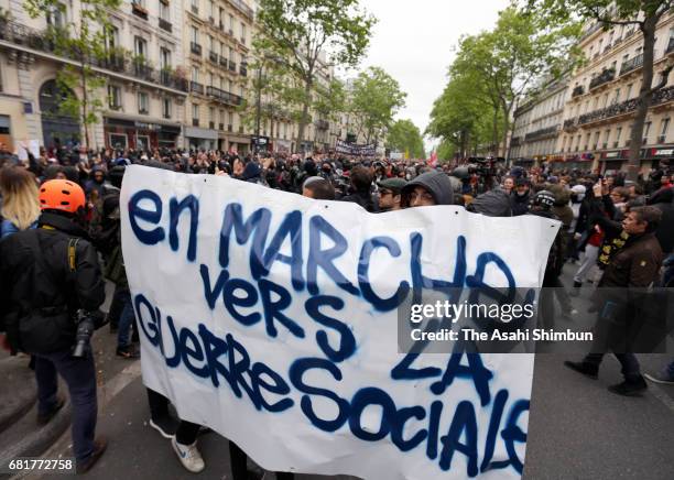 Demonstrators take part in a trade unions demonstrations against the election of Emmanuel Marcon on May 8, 2017 in Paris, France. The centrist...