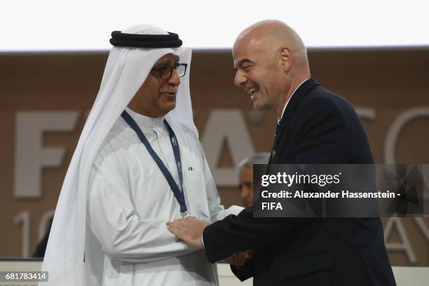 President Gianni Infantino talks to FIFA Council Members Sheikh Salman Bin Ebrahim Al Khalifa during the 67th FIFA Congress at the Bahrain...