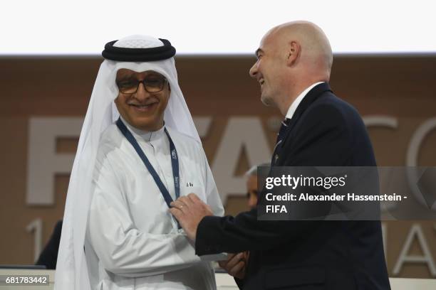 President Gianni Infantino talks to FIFA Council Members Sheikh Salman Bin Ebrahim Al Khalifa during the 67th FIFA Congress at the Bahrain...