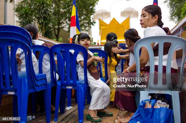Young buddhist devotee girl pictured during Vesak day celebration in Kuala Lumpur, Malaysia, on May 10, 2017. Vesak day on the full-moon day of the...