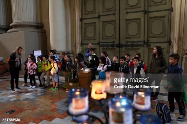 Italian schoolchildren on a class trip to the Cattedrale Metropolitana di San Pietro, the city's cathedral dedicated to St. Peter, on March 29, 2017...