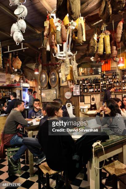 People eat at La Prosciutteria restaurant on March 29, 2017 in central Bologna, Italy. The restaurant, which originated in nearby Tuscany and now has...