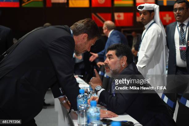 Legend Diego Maradona talks to FIFA Deputy Secretary General Zvonimir Boban during the 67th FIFA Congress at the Bahrain International Exhibition &...
