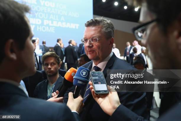 Council Member and President of the German Football Association Reinhard Grindel talks to the media after the 67th FIFA Congress at the Bahrain...