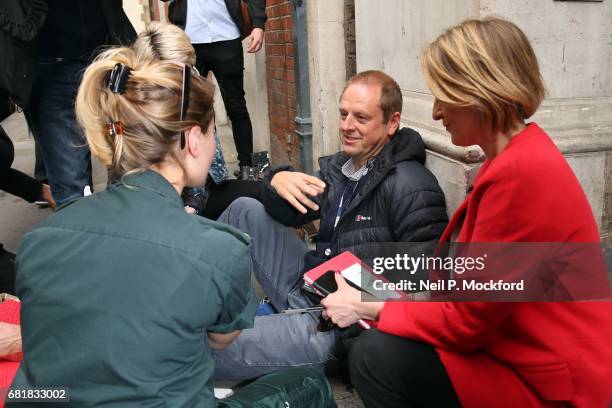 Cameraman Giles Wooltorton is helped by Ambulance staff after reportedly being hit by Labour Leader Jeremy Corbyn's vehicle outside Savoy Place, as...