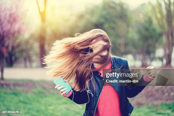 young girl dancing to the music - nodding head to music stock pictures, royalty-free photos & images