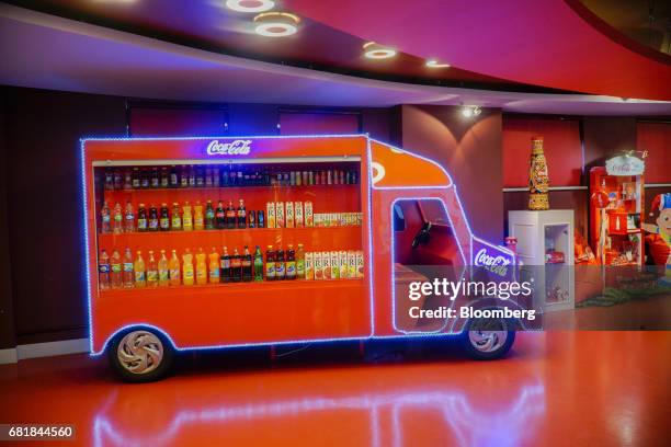 House soda and soft drinks brands sit on display in the visitors' center at the Coca-Cola Hellenic Bottling Co. SA plant in Brovary, Ukraine, on...