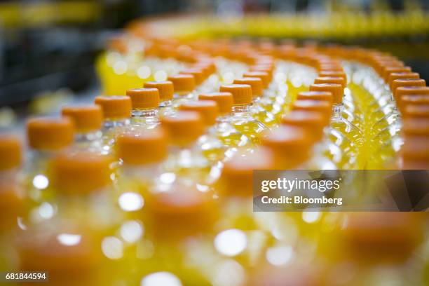 Bottles of Fanta fruit soda move along the automated production line at the Coca-Cola Hellenic Bottling Co. SA plant in Brovary, Ukraine, on...