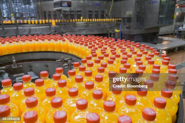 Bottles of Fanta fruit soda move along the automated production line at the Coca-Cola Hellenic Bottling Co. SA plant in Brovary, Ukraine, on...