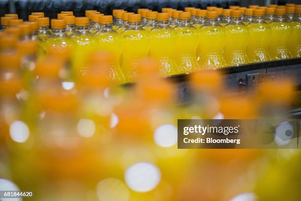 Bottles of Fanta fruit soda move along the automated production line at the Coca-Cola Hellenic Bottling Co. SA plant in Brovary, Ukraine, on...