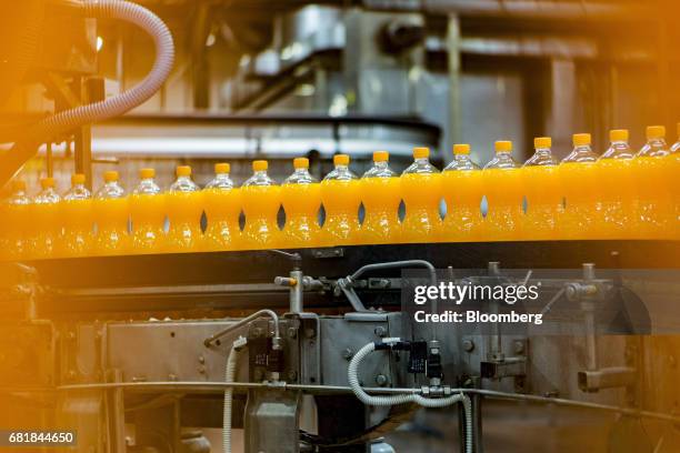 Bottles of Fanta fruit soda move along the automated production line at the Coca-Cola Hellenic Bottling Co. SA plant in Brovary, Ukraine, on...