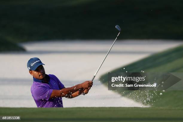 Fabian Gomez of Argentina plays a shot from a bunker on the tenth hole during the first round of THE PLAYERS Championship at the Stadium course at...