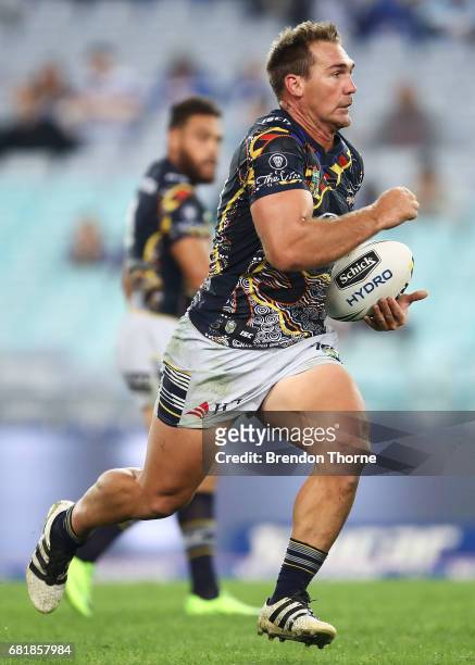 Scott Bolton of the Cowboys runs the ball during the round 10 NRL match between the Canterbury Bulldogs and the North Queensland Cowboys at ANZ...