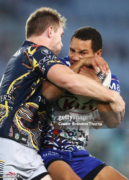 Moses Mbye of the Bulldogs is tackled by the Cowboys defence during the round 10 NRL match between the Canterbury Bulldogs and the North Queensland...