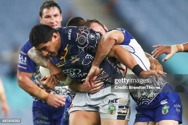 Jason Taumalolo of the Cowboys is tackled by the Bulldogs defence during the round 10 NRL match between the Canterbury Bulldogs and the North...