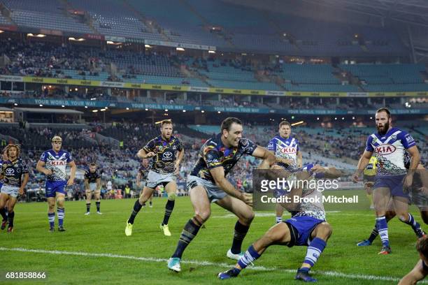 Will Hopoate of the Bulldogs is tackled during the round 10 NRL match between the Canterbury Bulldogs and the North Queensland Cowboys at ANZ Stadium...