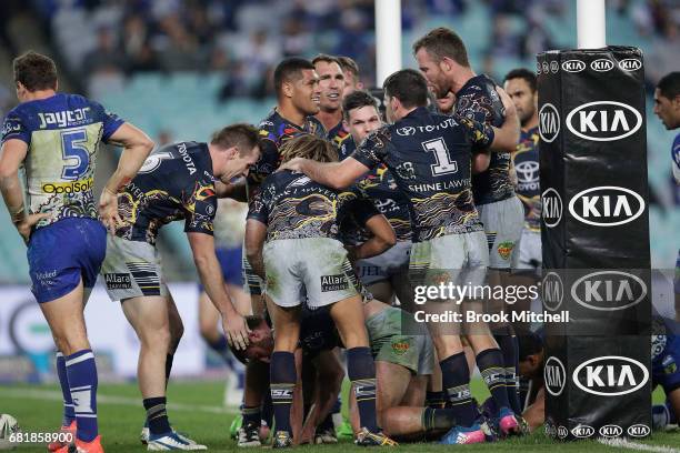Cowboys players celebrate a try during the round 10 NRL match between the Canterbury Bulldogs and the North Queensland Cowboys at ANZ Stadium on May...