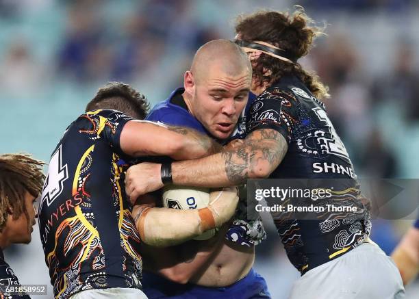 David Klemmer of the Bulldogs is tackled by the Cowboys defence during the round 10 NRL match between the Canterbury Bulldogs and the North...