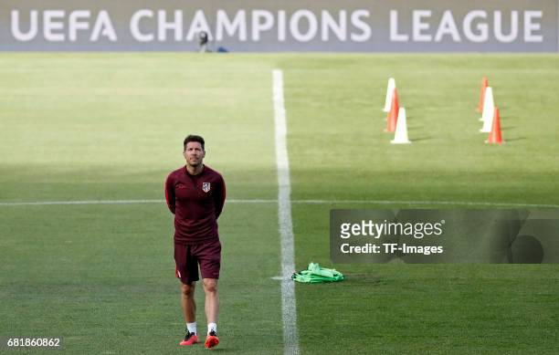 Head coach Diego Simeone of Atletico Madrid looks on during a training session ahead of the UEFA Champions League Semifinal Second leg match between...