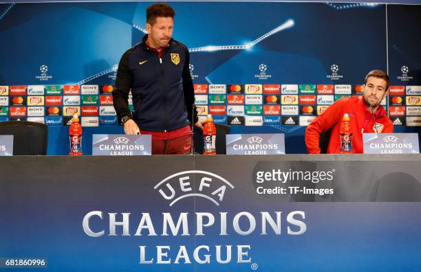 Gabi Fernandez of Atletico Madrid and Head coach Diego Simeone of Atletico Madrid attends a press conference ahead of the UEFA Champions League...