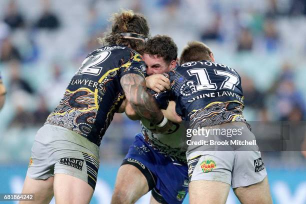 Adam Elliot of the Bulldogs is tackled during the round 10 NRL match between the Canterbury Bulldogs and the North Queensland Cowboys at ANZ Stadium...