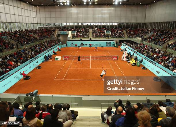 Fabio Fognini of Italy and Treat Huey of Philippinnes in action in their doubles match against Marcel Granollers of Spain and Ivan Dodig of Croatia...
