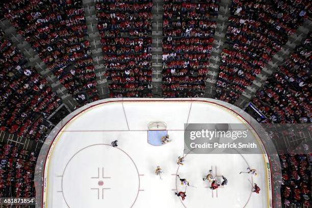 Evgeny Kuznetsov of the Washington Capitals and Nick Bonino of the Pittsburgh Penguins face off in the third period in Game Seven of the Eastern...