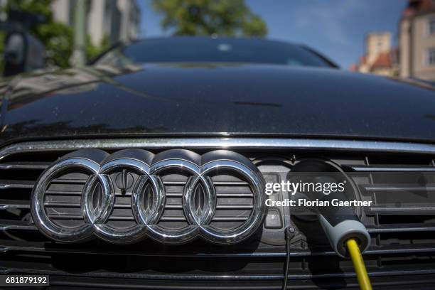 An electric car of Audi is charged by an electric filling station on May 11, 2017 in Berlin, Germany.